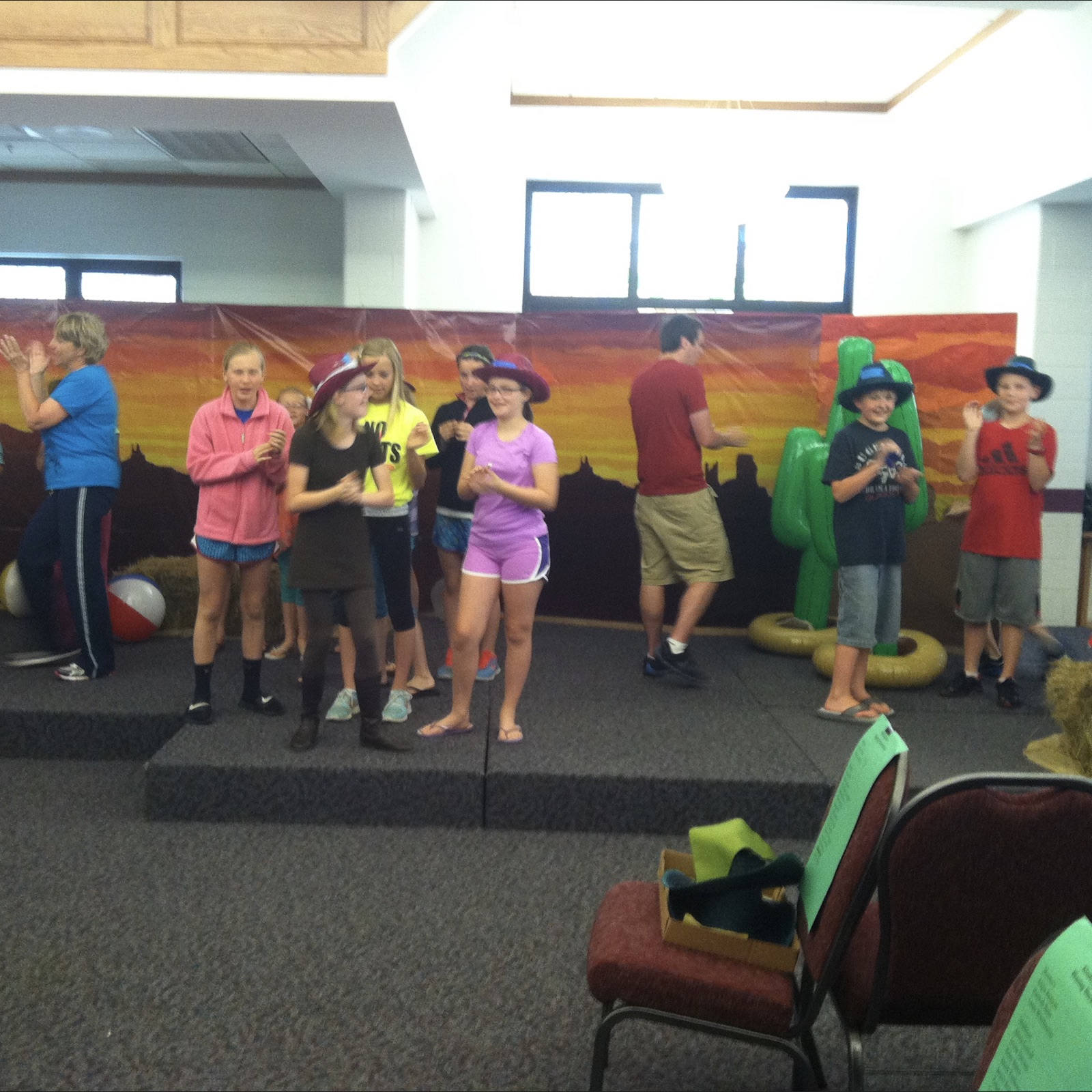 Volunteers helping with children’s activities at church camp